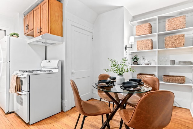 dining area featuring light wood-style floors