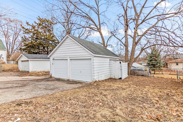 detached garage with fence