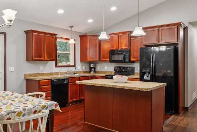 kitchen featuring black appliances, dark wood finished floors, and light countertops