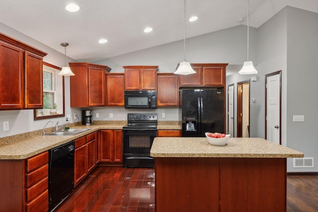 kitchen featuring visible vents, dark wood finished floors, a sink, black appliances, and light countertops