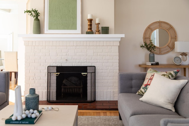 living room with a fireplace and wood finished floors