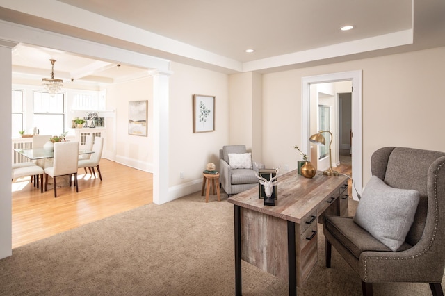 office featuring baseboards, ornate columns, recessed lighting, light carpet, and a raised ceiling