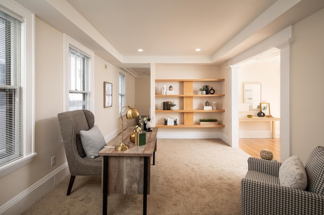 carpeted office space featuring built in shelves, recessed lighting, and baseboards