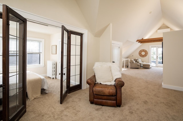 sitting room with radiator heating unit, french doors, baseboards, and carpet floors