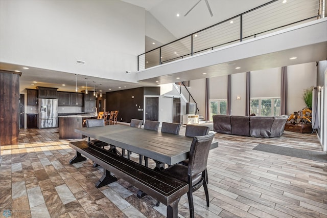 dining area with stairs, recessed lighting, wood finished floors, and visible vents