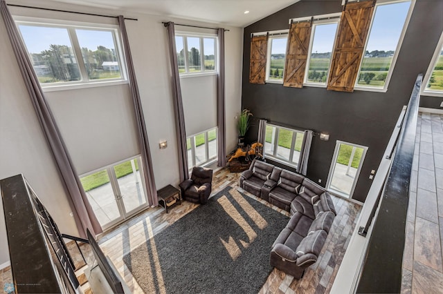 living room featuring lofted ceiling and recessed lighting