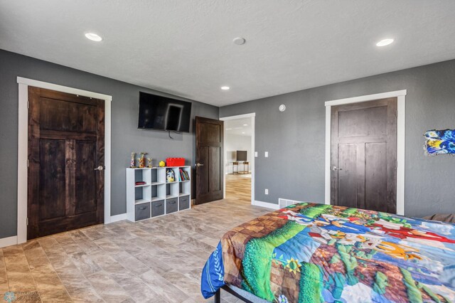 bedroom featuring recessed lighting and baseboards