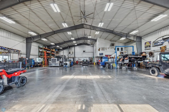 garage with a workshop area and metal wall