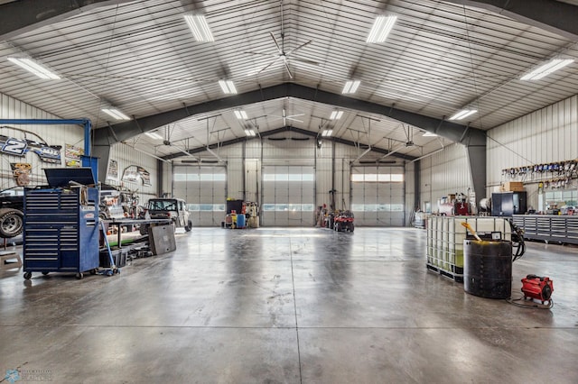 garage featuring a workshop area and metal wall