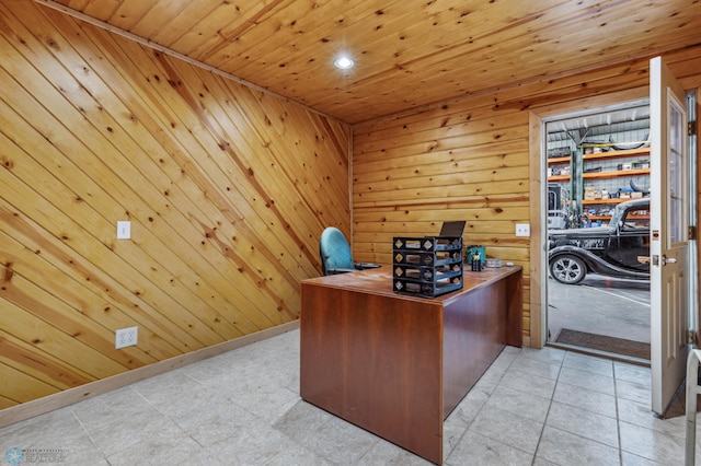 office space with wooden walls, wood ceiling, and baseboards