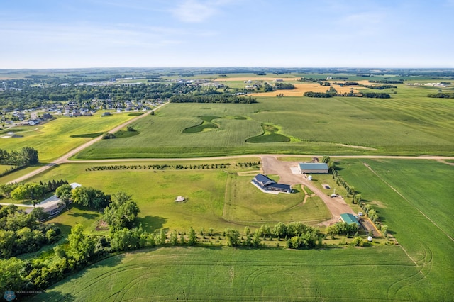 birds eye view of property with a rural view