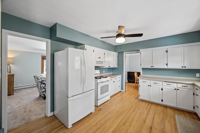 kitchen featuring white appliances, light countertops, white cabinetry, light wood-type flooring, and baseboard heating