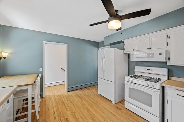 kitchen featuring a baseboard heating unit, white appliances, and white cabinets