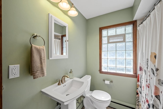 full bath featuring a sink, a shower with shower curtain, toilet, and a baseboard radiator