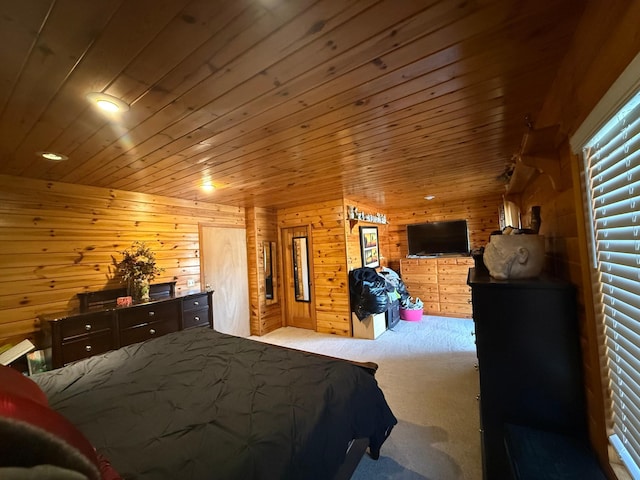 carpeted bedroom featuring wooden ceiling and wood walls