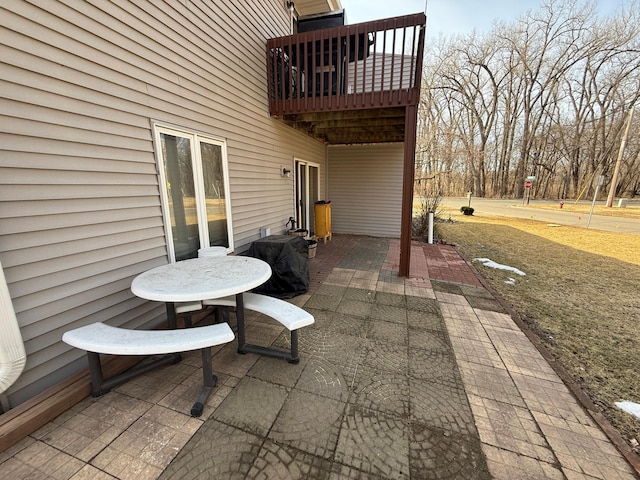 view of patio featuring a balcony and area for grilling