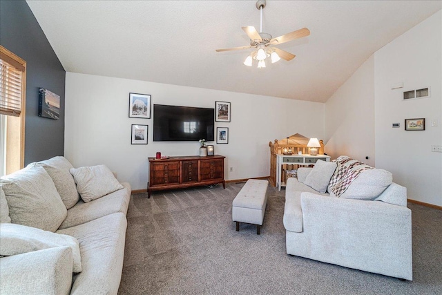 living area with visible vents, carpet flooring, baseboards, ceiling fan, and vaulted ceiling