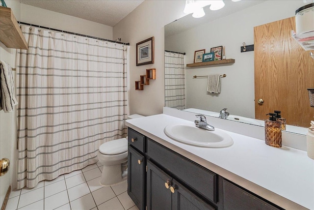 full bath featuring a textured ceiling, toilet, vanity, and tile patterned flooring