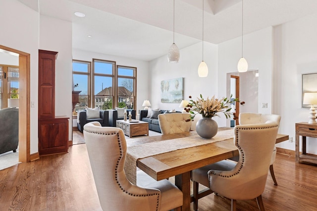 dining room featuring wood finished floors and baseboards