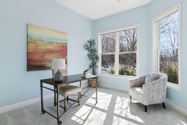 home office with baseboards and carpet flooring