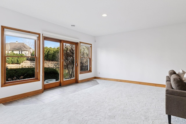 unfurnished room featuring recessed lighting, baseboards, and light colored carpet