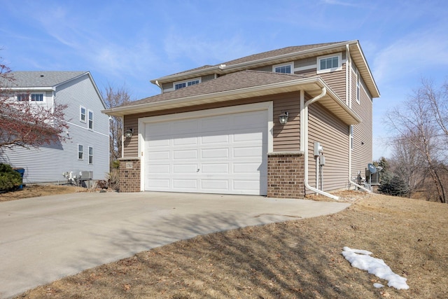 view of front of property featuring a garage, brick siding, and driveway