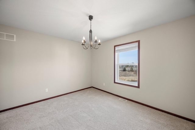 unfurnished room with visible vents, baseboards, a notable chandelier, and light colored carpet