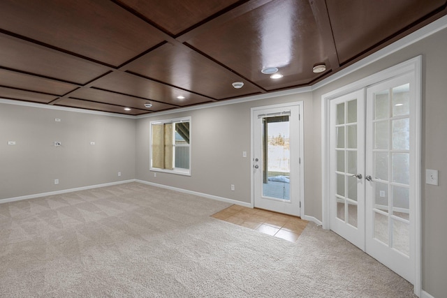 unfurnished room with light tile patterned floors, french doors, baseboards, and light carpet