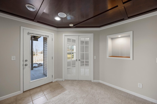 entryway with light colored carpet, french doors, baseboards, and coffered ceiling