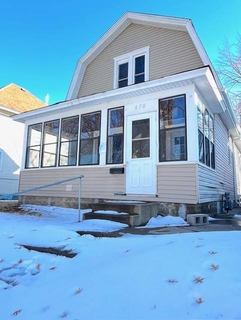 dutch colonial with a gambrel roof and a sunroom