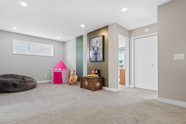 recreation room with recessed lighting, baseboards, and carpet flooring