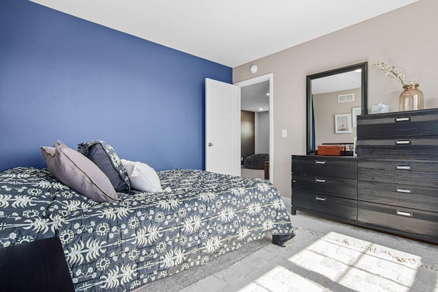 bedroom featuring visible vents