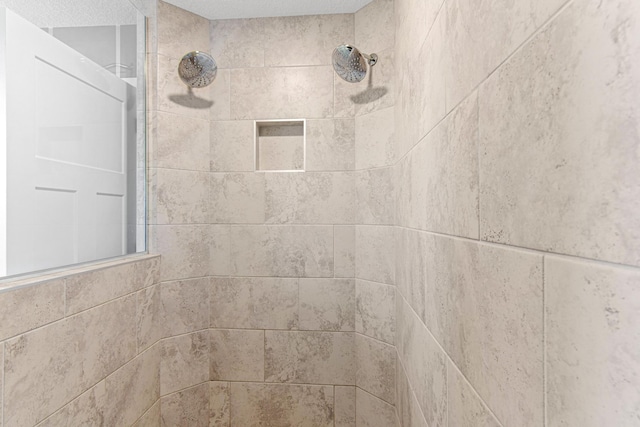 details with a tile shower