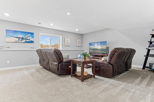 living area with light carpet, recessed lighting, a textured ceiling, and baseboards