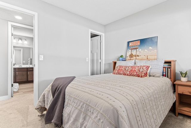 carpeted bedroom with connected bathroom