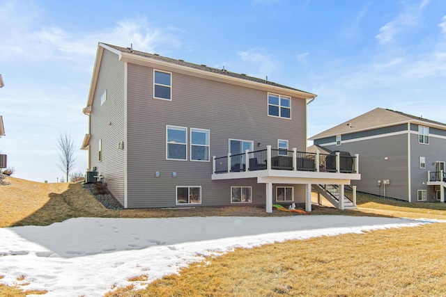 rear view of house with a deck, stairway, and central AC unit