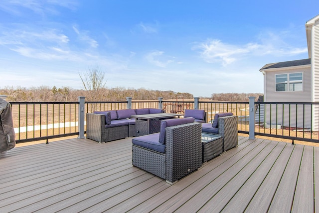 wooden terrace with outdoor lounge area