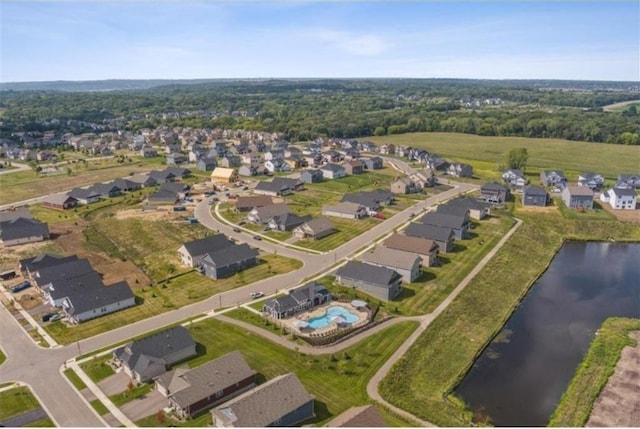 birds eye view of property with a residential view and a water view