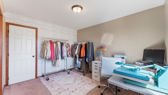 office featuring carpet and brick wall