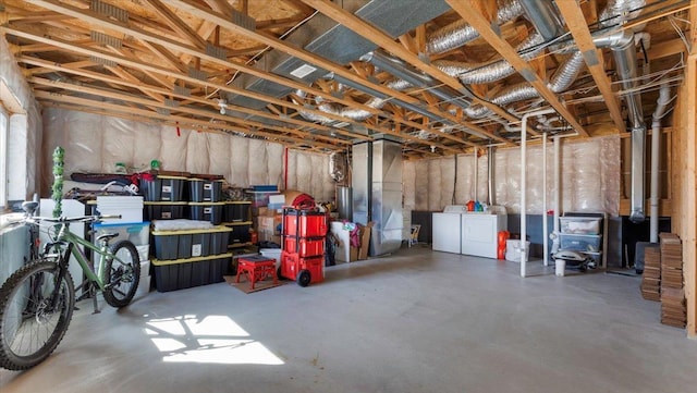 unfinished basement with separate washer and dryer