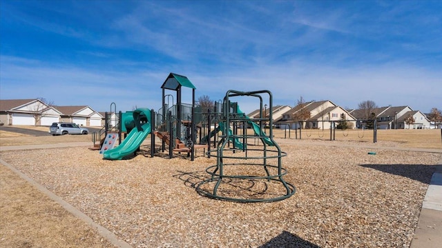 communal playground featuring a residential view