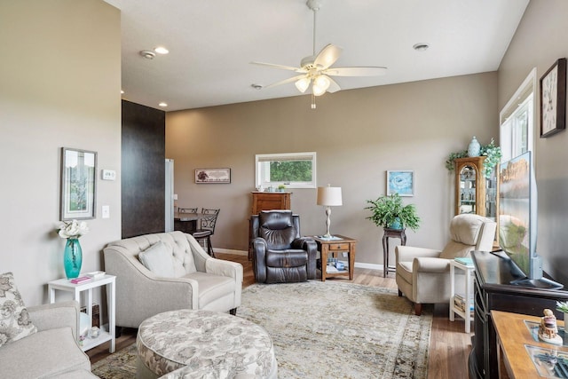 living area featuring recessed lighting, baseboards, ceiling fan, and wood finished floors