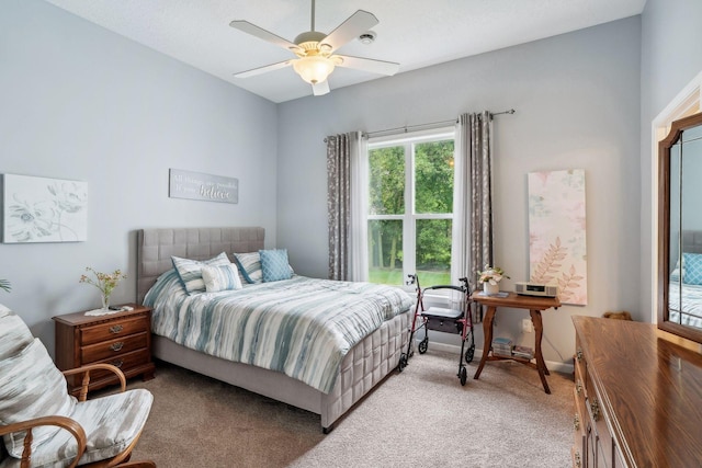 carpeted bedroom with baseboards and a ceiling fan