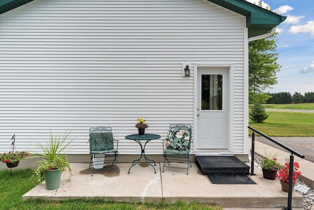 doorway to property with a patio