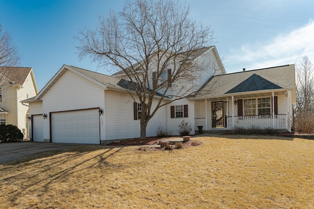 traditional home with a garage, a front lawn, a porch, and driveway