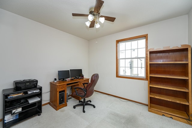 home office featuring baseboards, carpet floors, and ceiling fan