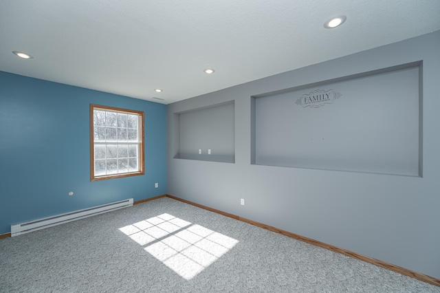 unfurnished room with recessed lighting, baseboards, and baseboard heating