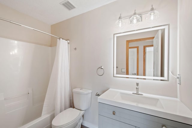 bathroom featuring vanity, visible vents, shower / bath combination with curtain, a textured ceiling, and toilet