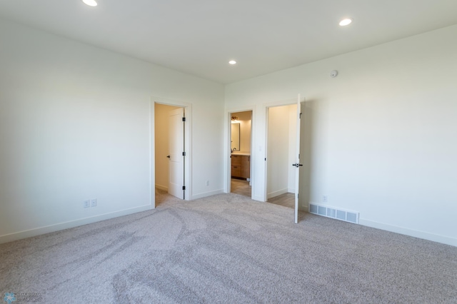 unfurnished bedroom with recessed lighting, baseboards, and visible vents