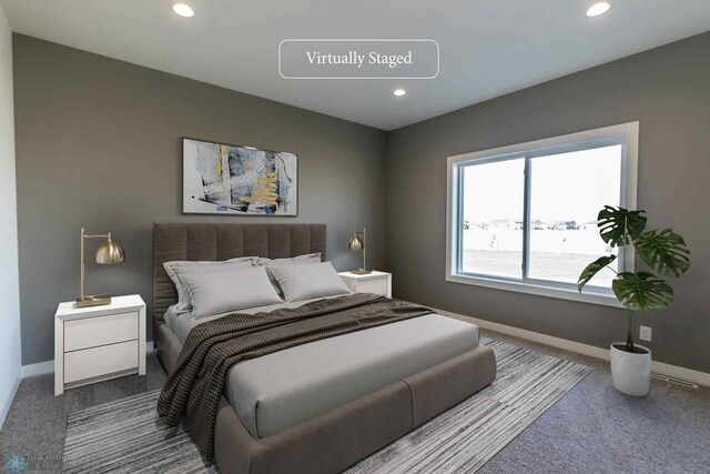 carpeted bedroom featuring baseboards and recessed lighting